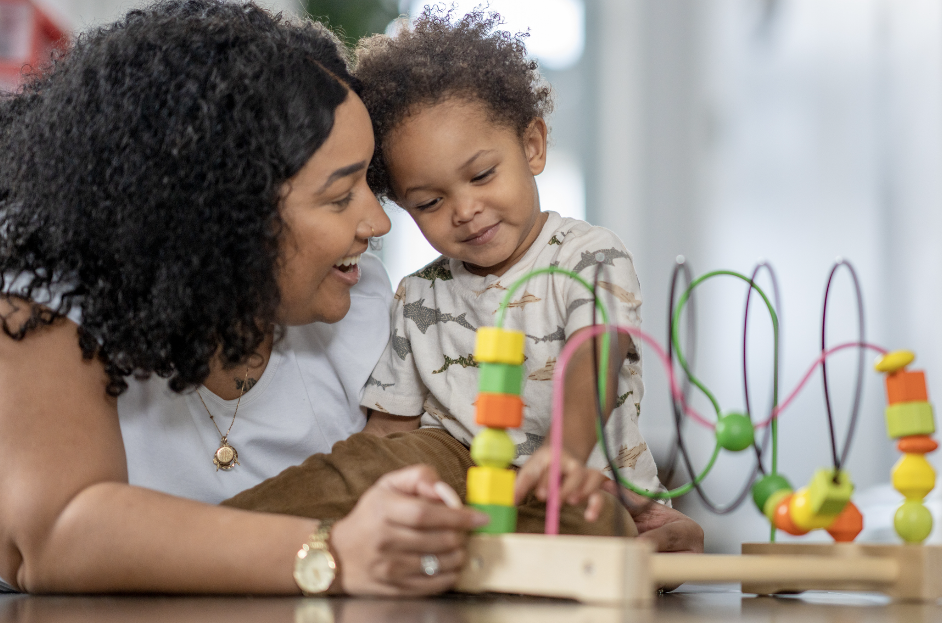 Occupational therapist working with a young child during a therapy session
